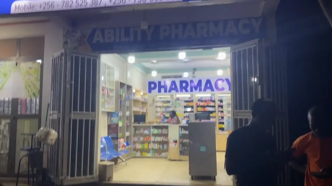 Ability Pharmacy interior branding and signage installation by Kamog Artistry (U) Ltd