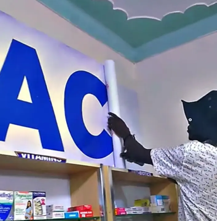 Vinyl sticker installation process for Ability Pharmacy branding
