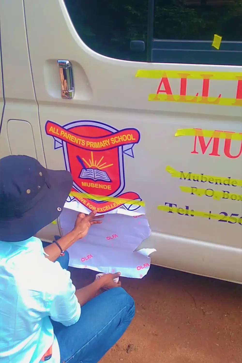 Side branding graphics installation for school van