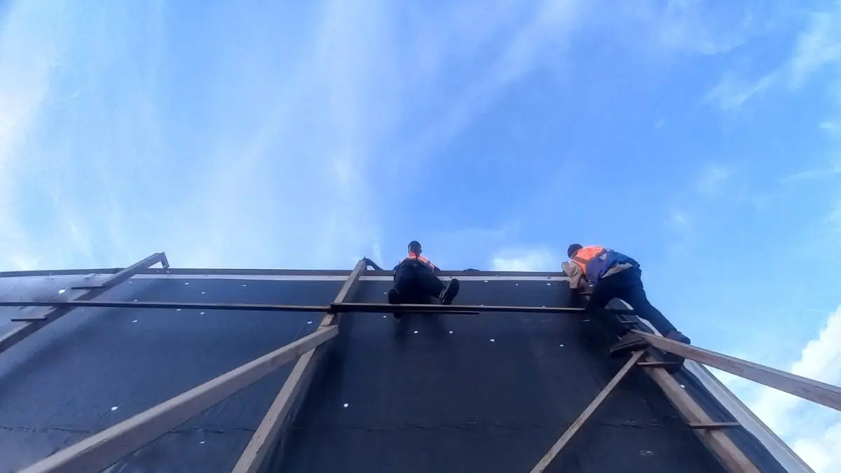 Controlled ventilation openings across the Goodwill Nakasero rooftop billboard