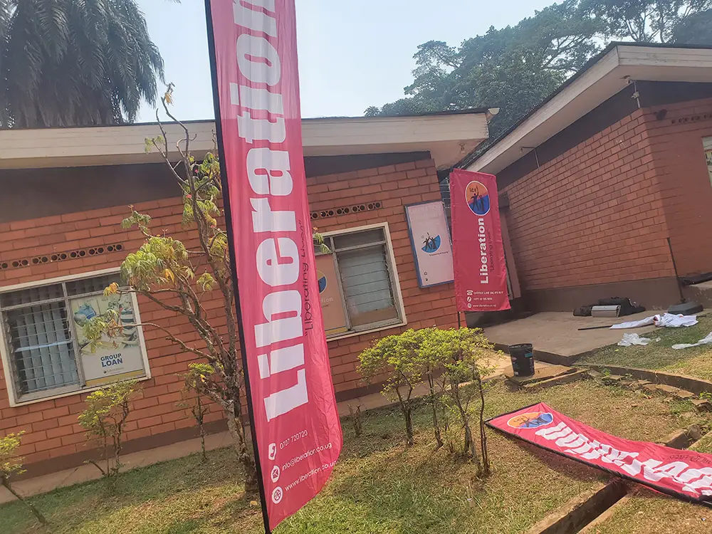 Liberation Community Finance teardrop banners delivered at the Namirembe office compound.