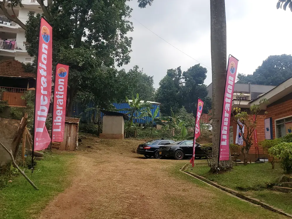 4.5m Liberation Community Finance teardrop banners installed for outdoor visibility at the office compound.