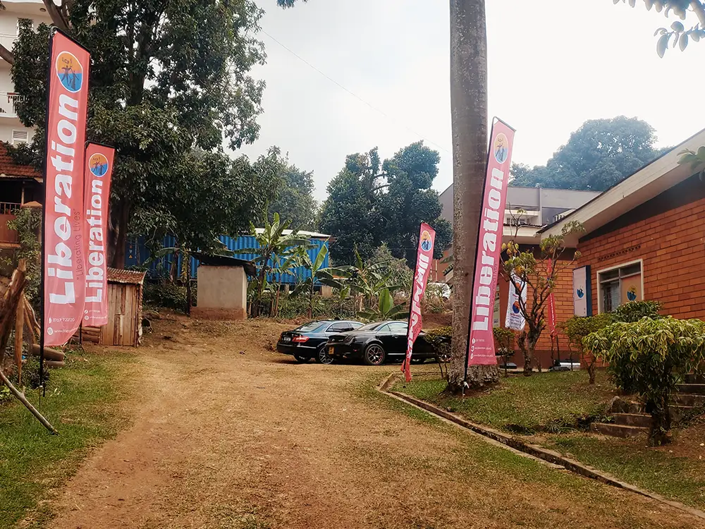 Liberation Community Finance six 4.5m telescopic/L-shape teardrop banners installed at Namirembe office