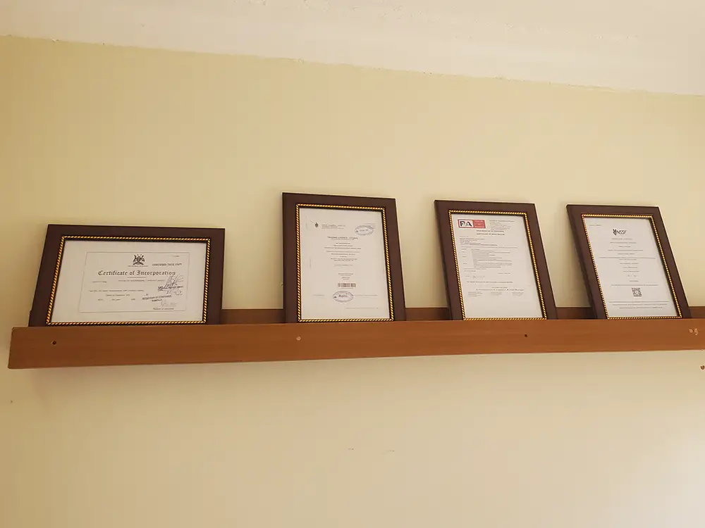 Corporate certificate frames wall display from Masakaki Engineering company branding case study by Kamog Artistry (U) Ltd