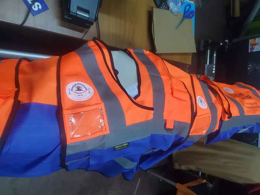 Front view of completed branded safety wear from Masakaki Engineering company branding case study by Kamog Artistry (U) Ltd