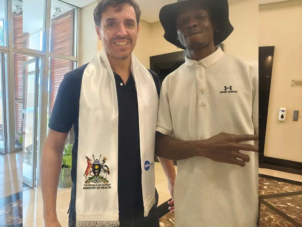 RBM Partnership to End Malaria conference branding, custom scarves, pull up banner and tear drop banner printing project in Kampala by Kamog Artistry (U) Ltd