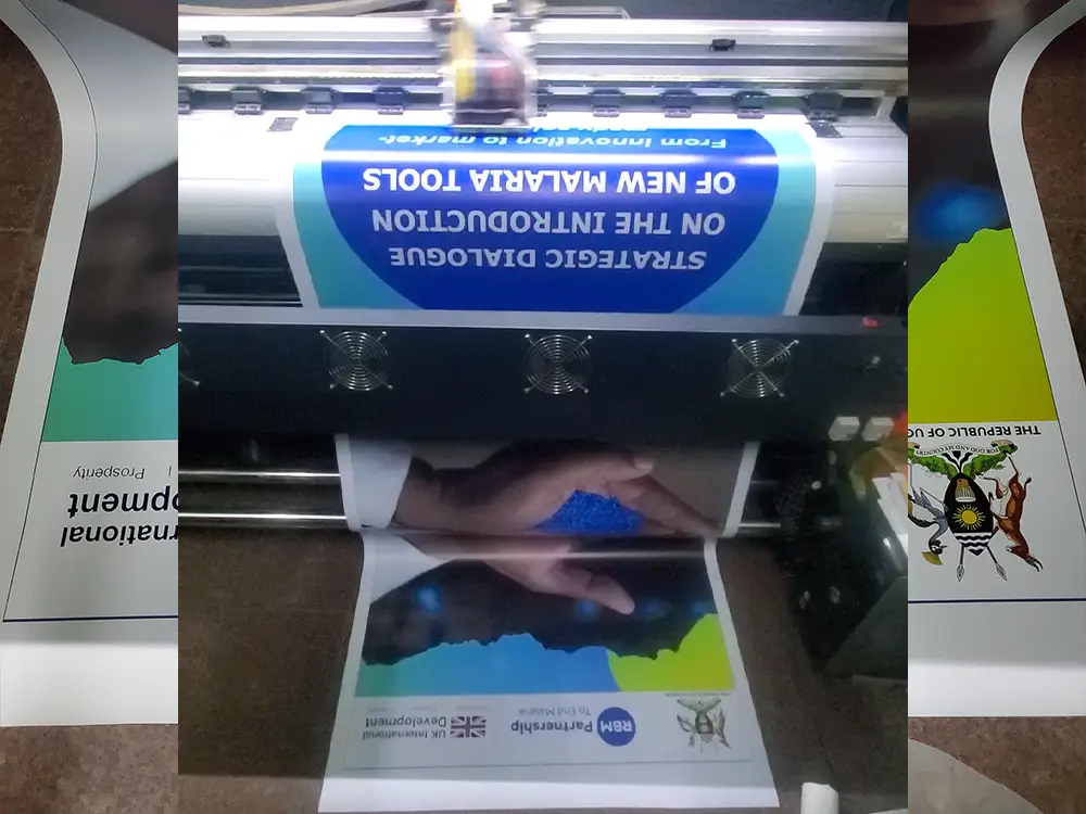 Large format printing in progress from RBM Partnership to End Malaria event branding case study by Kamog Artistry (U) Ltd