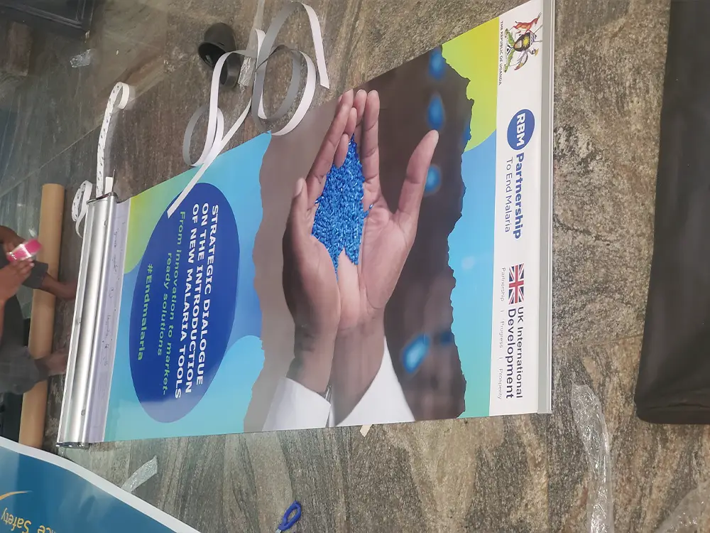 Banner finished and standing cleanly from RBM Partnership to End Malaria event branding case study by Kamog Artistry (U) Ltd