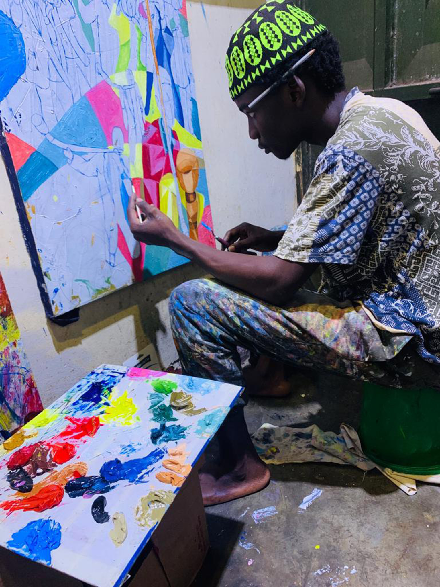 Traditional fine art painting process in Central Uganda (controlled layering and protective finishing)