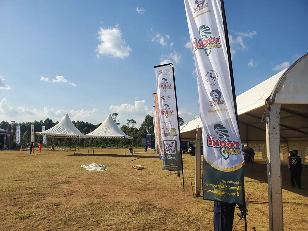 Teardrop banners beside event tents — Tall teardrop banners positioned beside the event tents for .