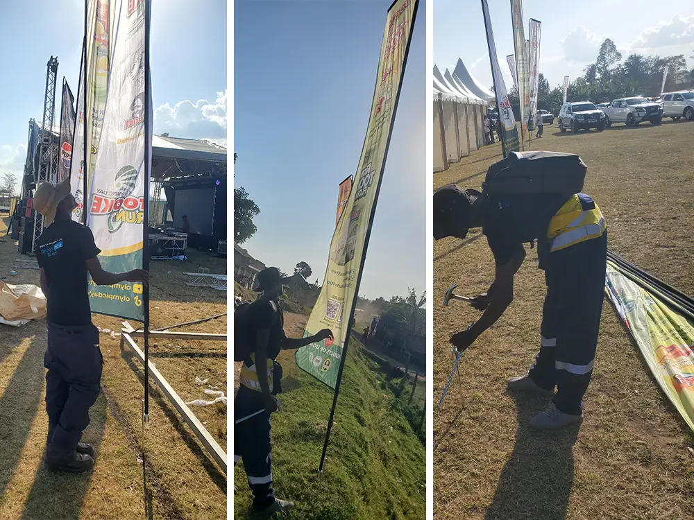 Teardrop flags lining the venue — Event teardrop flags arranged to create a branded line around the Bushenyi event environment.