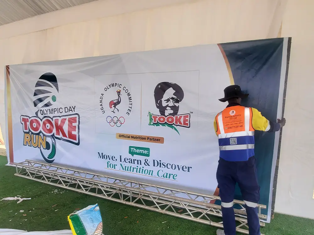 Official Tooke Run 2026 VIP tent sponsor backdrop installation in Bushenyi