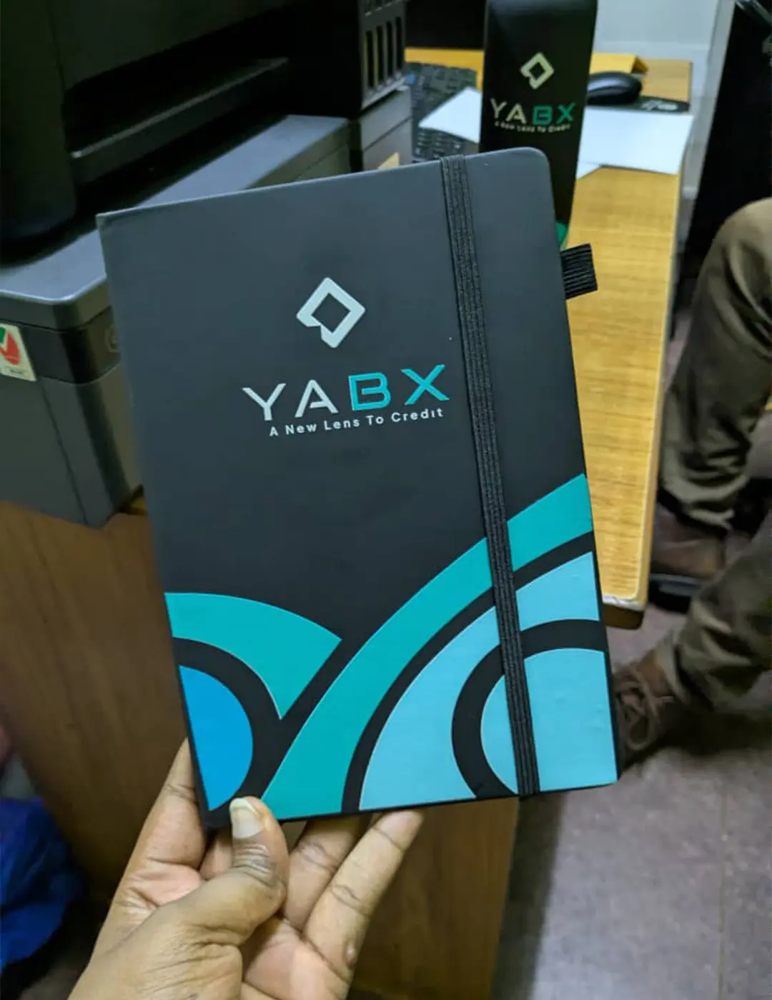 Branded notebook cover custom stationery merchandise detail for YABX