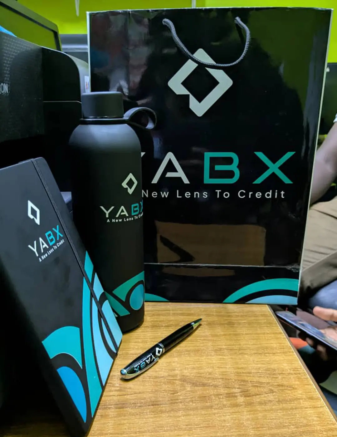 YABX Christmas package with branded notebook bottle pen greeting card and gift bag