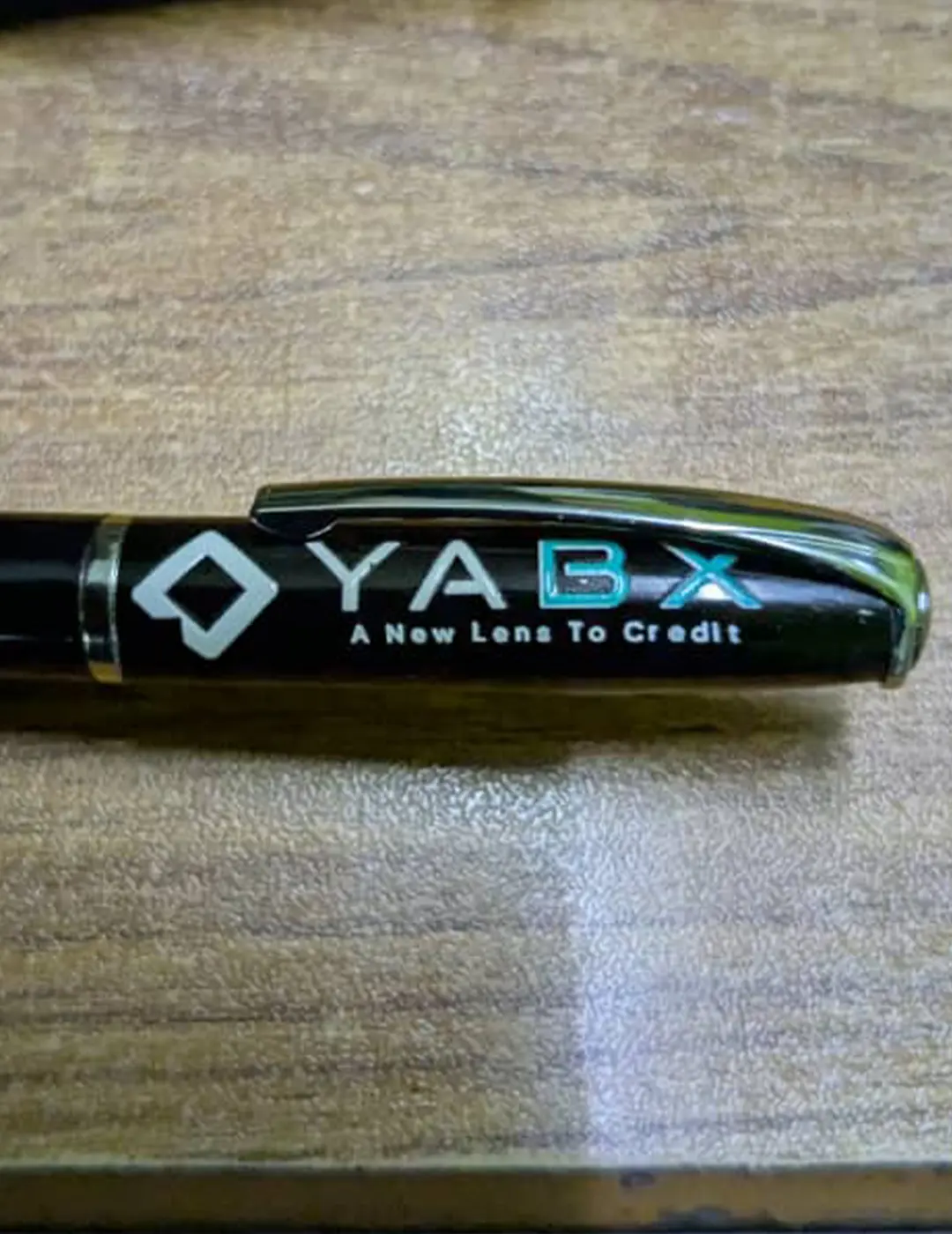 Branded logo pen corporate merchandise closeup for YABX project