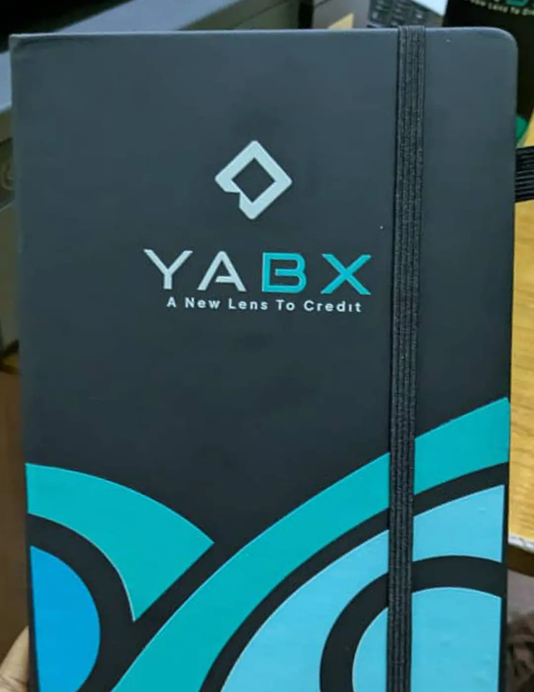 YABX custom corporate gift pack with branded notebook, bottle, logo pen and gift bag by Kamog Artistry (U) Ltd
