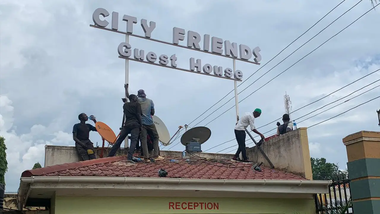 Signage installation planning in Uganda showing mounting height access and site preparation requirements